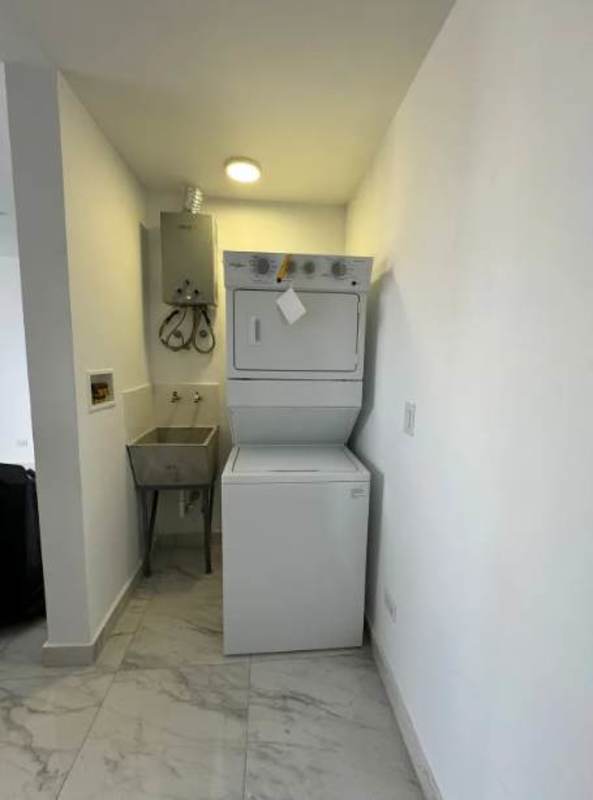 Laundry space with washer dryer hookup and sink in PH The Gray Panama