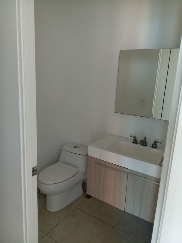 Large sliding glass living with balcony and ocean view in PH H2O Panama City