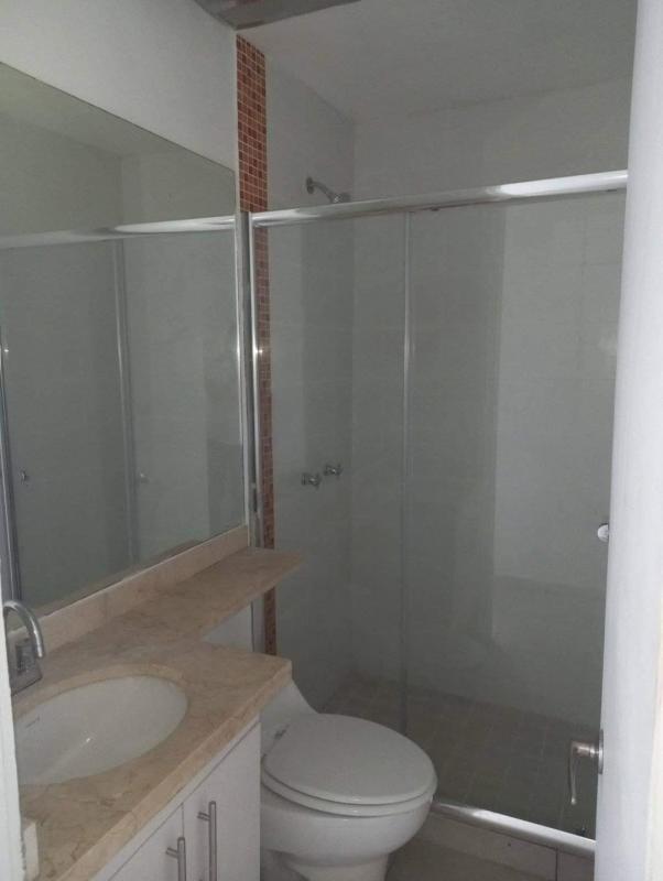 Bright tiled living room with balcony access and split AC at PH Alsacia Tower Condado del Rey Panama City