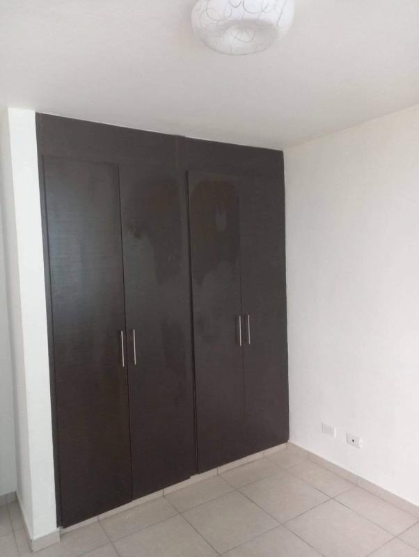 Empty bedroom with built-in wardrobe, tile floors at PH Alsacia Tower Panama