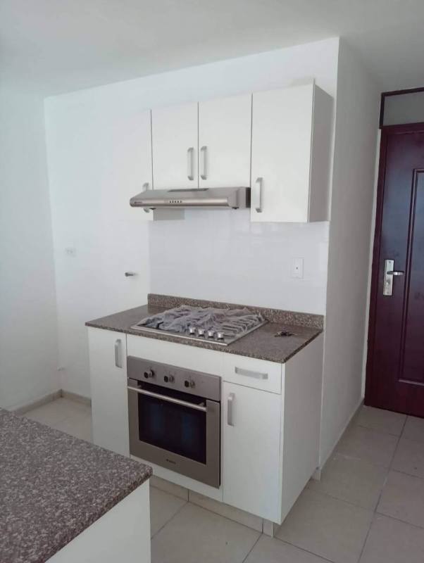 Bedroom with white tile floor, built-in wardrobe modern minimalist style PH Alsacia Tower Panama