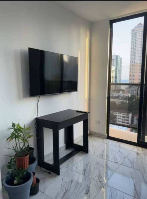 Open-plan kitchen with granite countertops marble floor gas stove furnished PH The Gray Panama