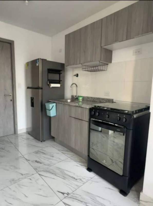 Bright living room with marble floors and panoramic city view PH The Gray Calle 50 Panama City