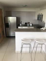 Dining space adjacent to large window with natural light PH River Valley Panama Pacifico