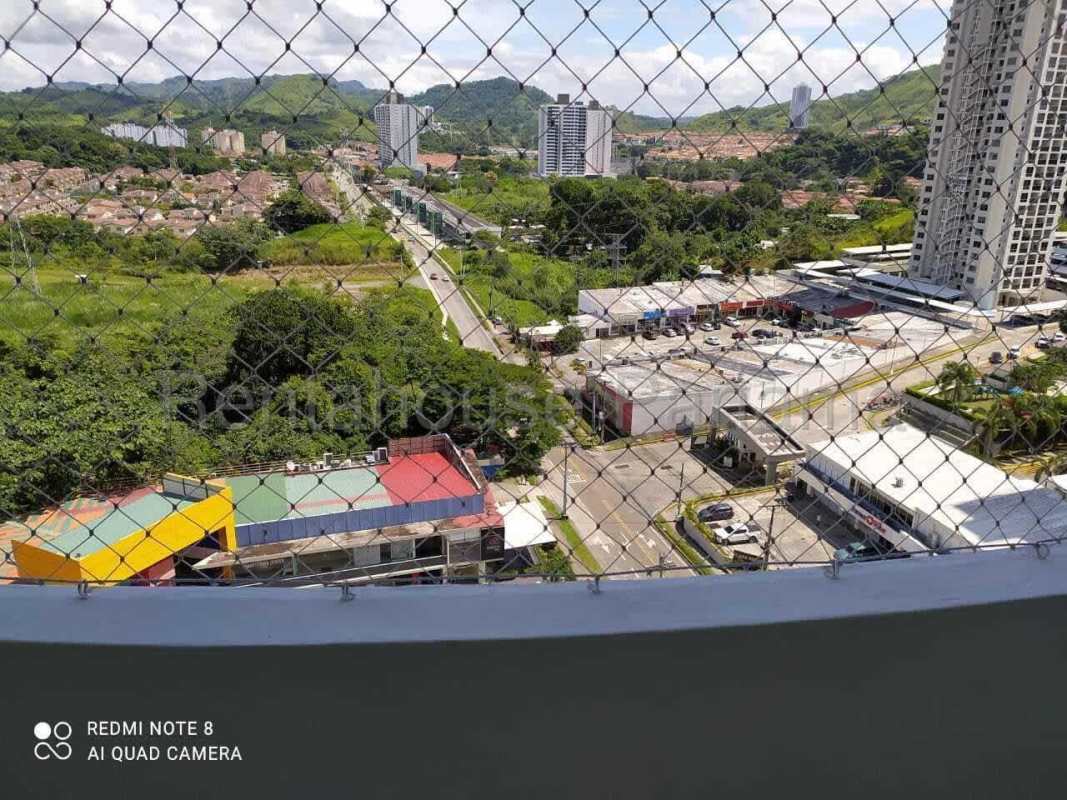 High-rise towers with balconies and palm trees at PH Green Park residential complex in Panama