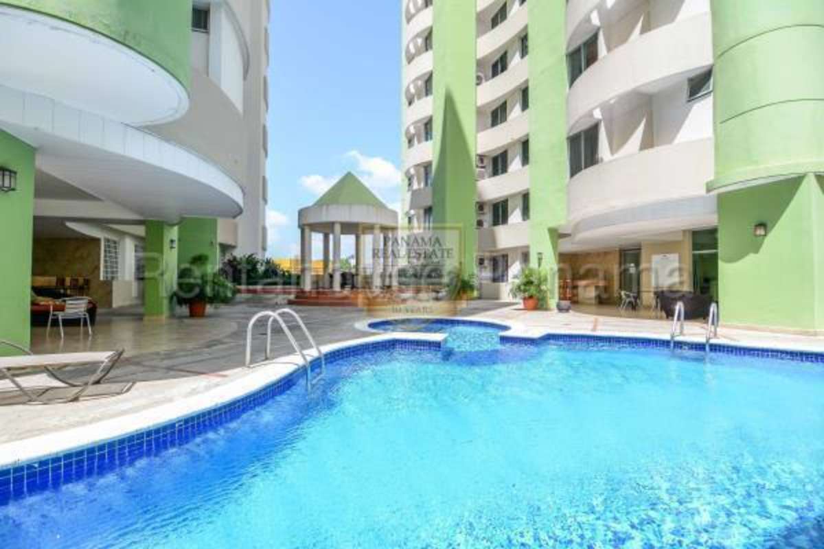 Laundry room with instant water heater and utility sink in Panama apartment