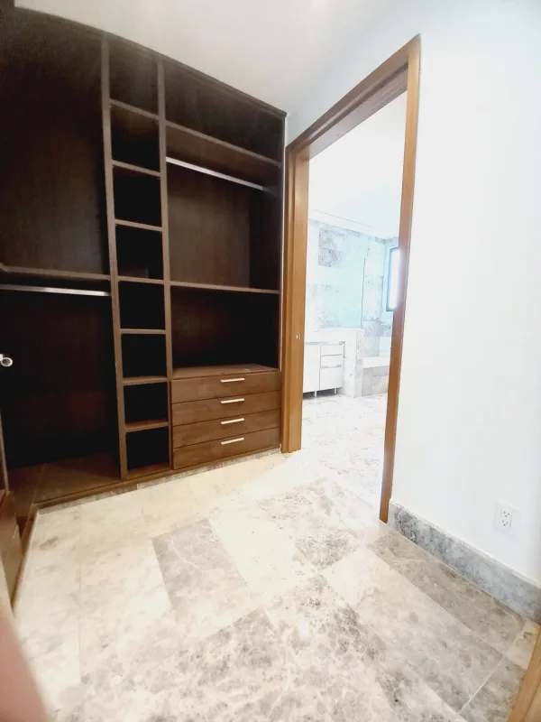 Spacious master bedroom with marble flooring, large windows and panoramic golf views PH Empire Residences Panama