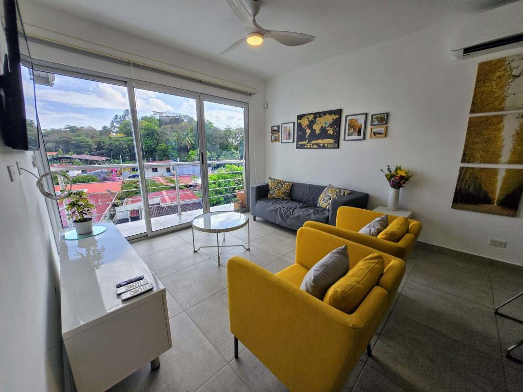 Bedroom space with ceiling fan, built-in wardrobe, large windows, city views in PH Arsema Betania Panama