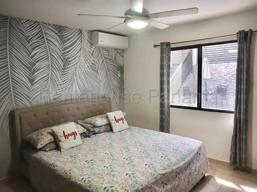 Twin beds with colorful bedding in kids room PH Vistas del Lago Las Cumbres