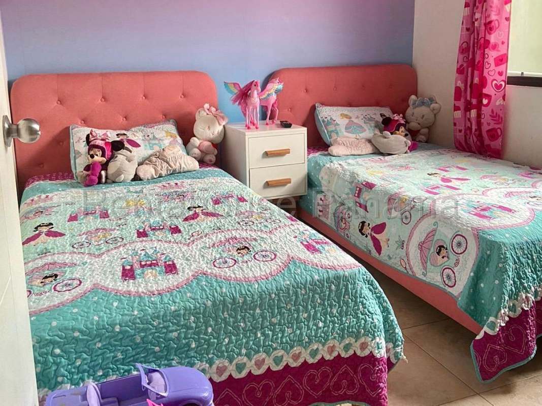 Kids' bedroom with Spider-Man bedding, desk area, large window PH Vistas del Lago Las Cumbres