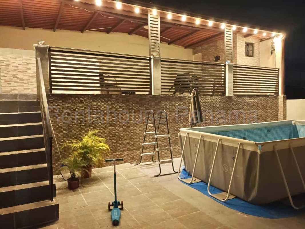 Backyard with above ground pool, patio view, hillside background in PH Vistas del Lago Las Cumbres