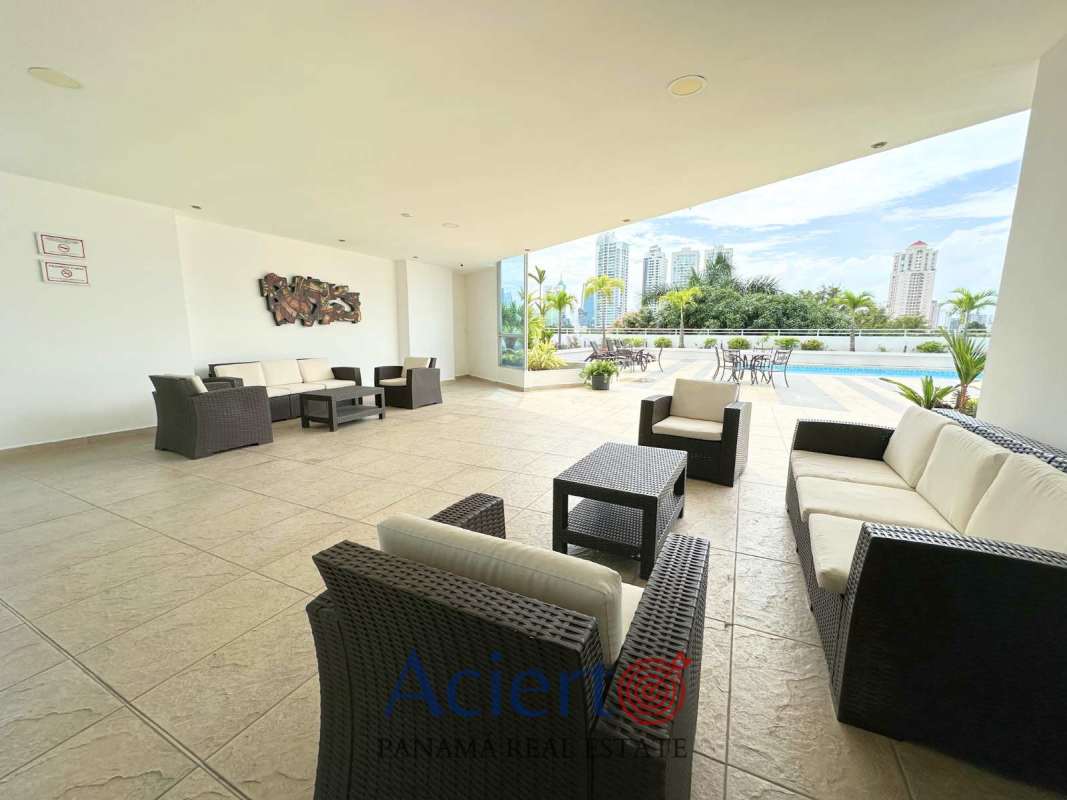 Condo pool deck with terrace lounge and Panama City skyline at PH San Francisco