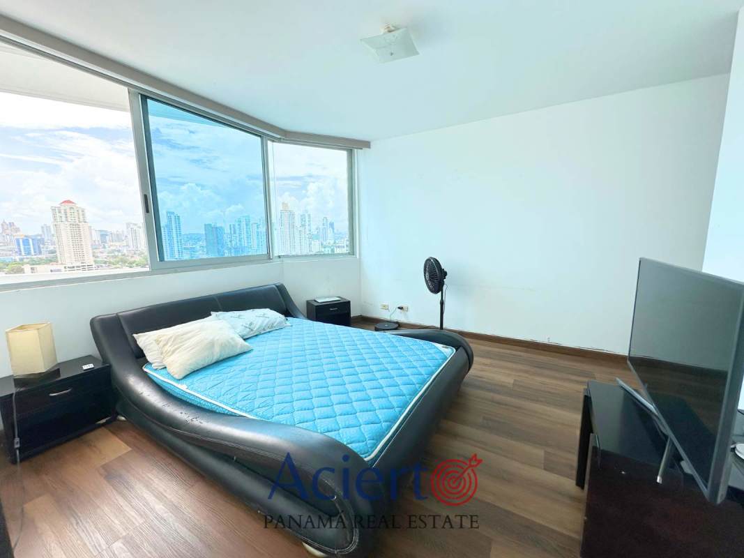 Modern bedroom with panoramic window, skyline city view at PH San Francisco Panama