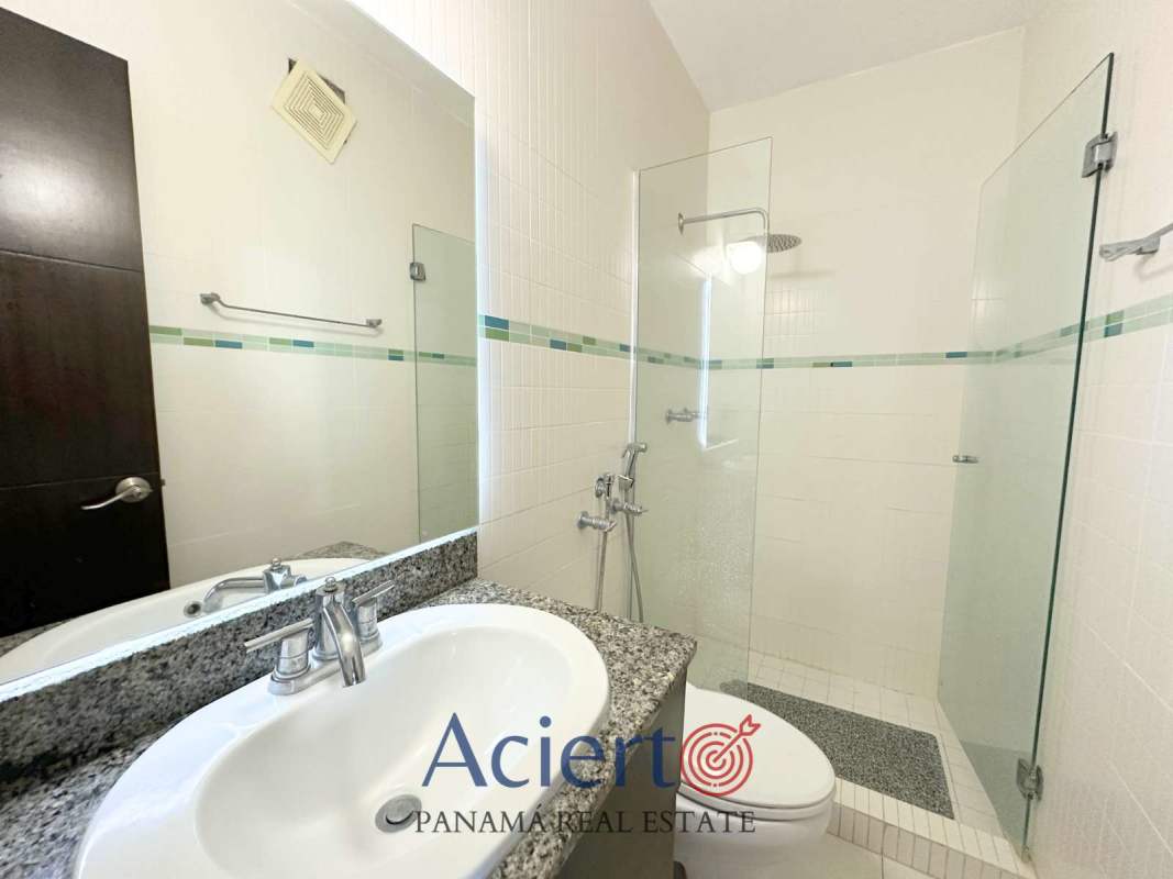 Bedroom with dark wood wardrobe, minimalist decor, PH San Francisco Panama