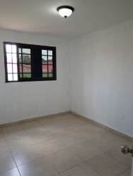Bathroom with beige tiles, shower, sink, and toilet Villa de Santander Cerro Silvestre