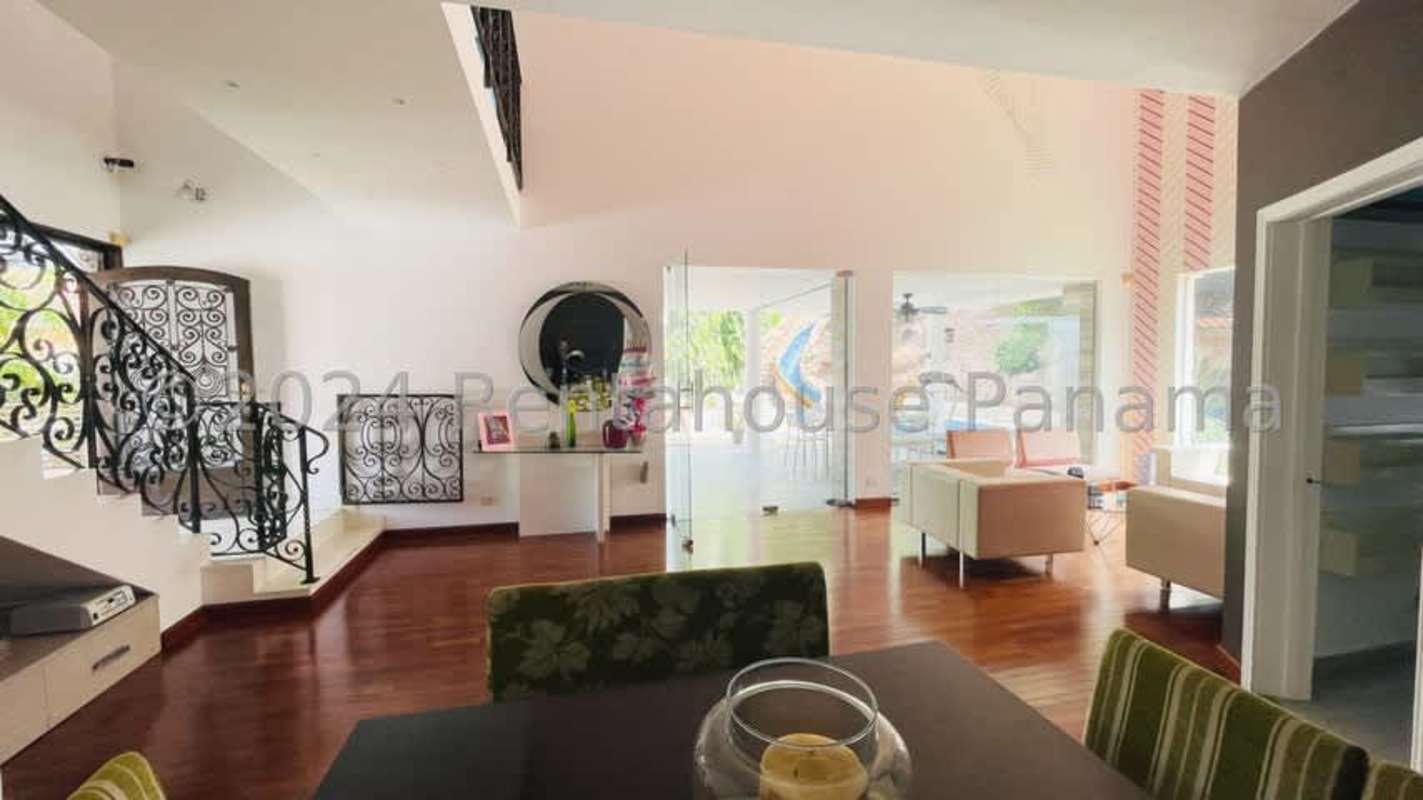 Luxury backyard with swimming pool, waterfall, lush landscape Altos de Panamá residence for sale