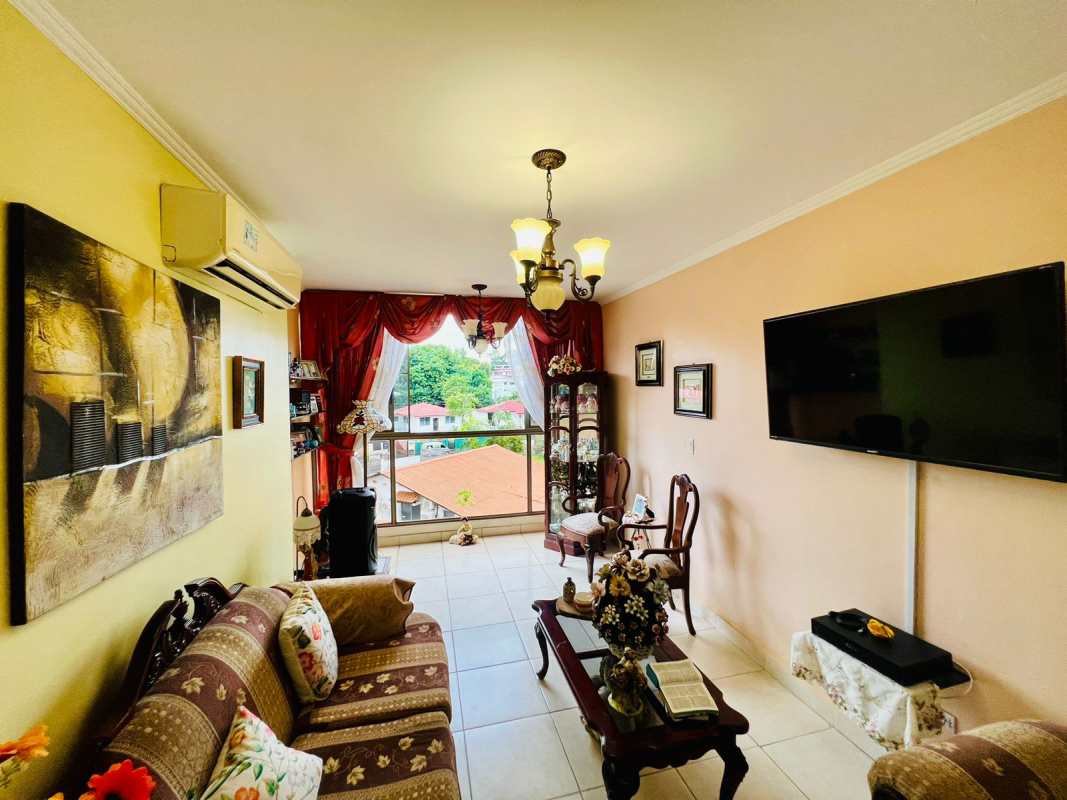 Traditional kitchen with granite counter, red cabinets, tile backsplash and appliances in Betania Panama
