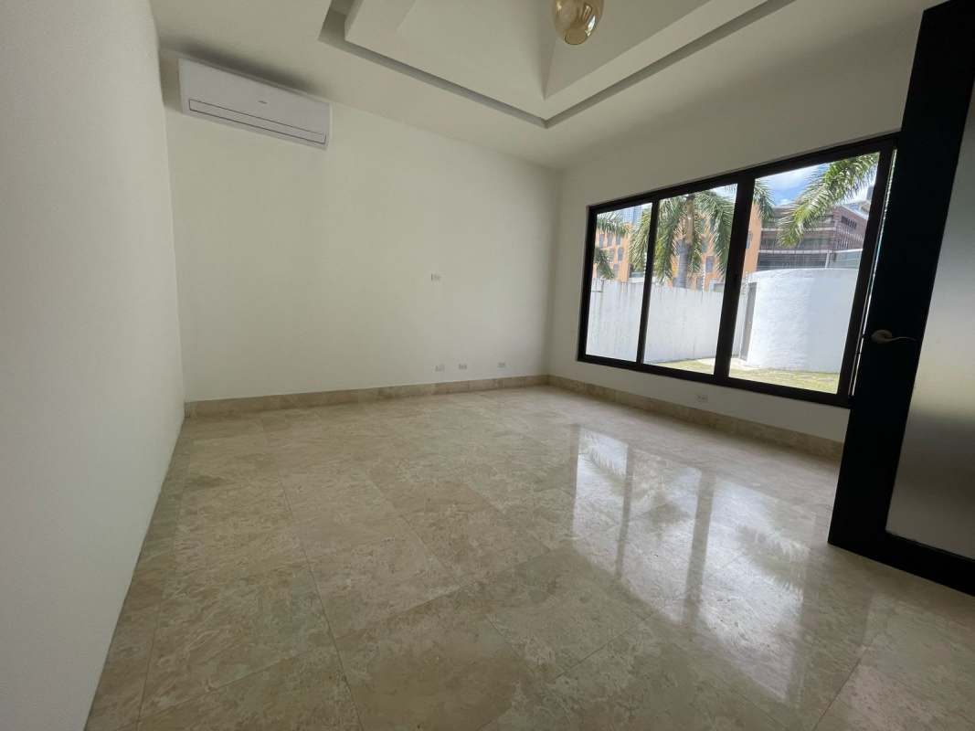 Spacious double-height living room with marble floors large windows Costa del Este