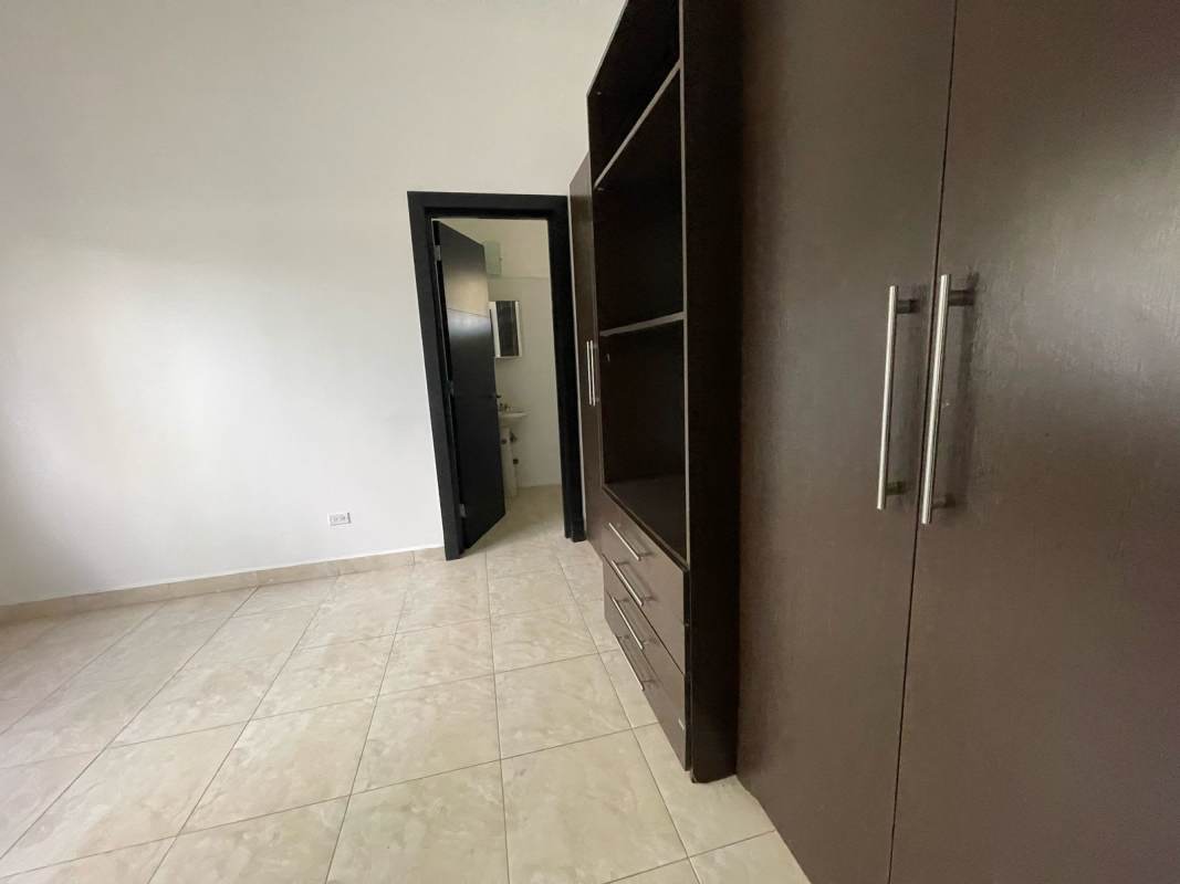 Modern bedroom with balcony large windows private bath Costa del Este Panama