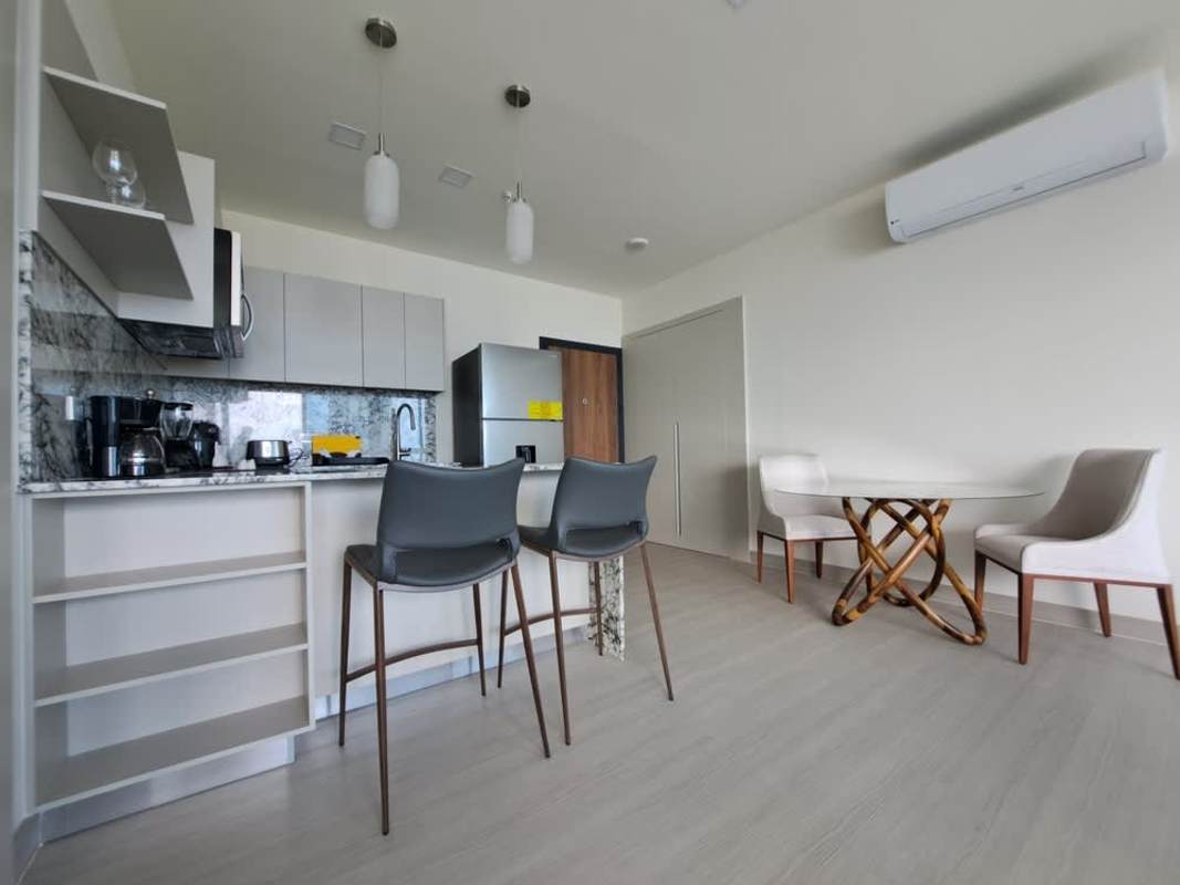 Contemporary apartment living space with skyline view at PH Arcadia Costa del Este