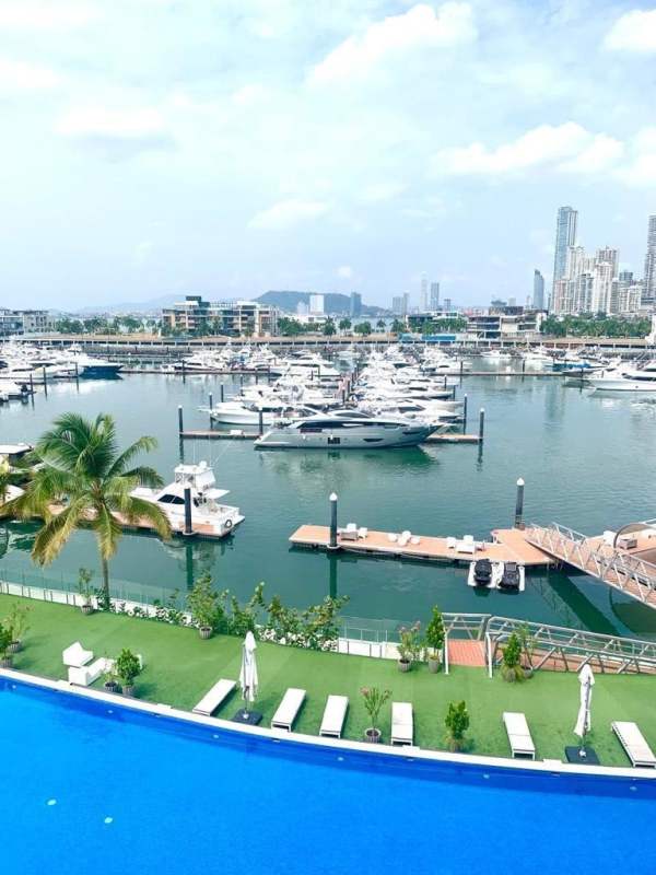 Waterfront infinity pool overlooking marina city skyline yachts at Ocean Reef Panama