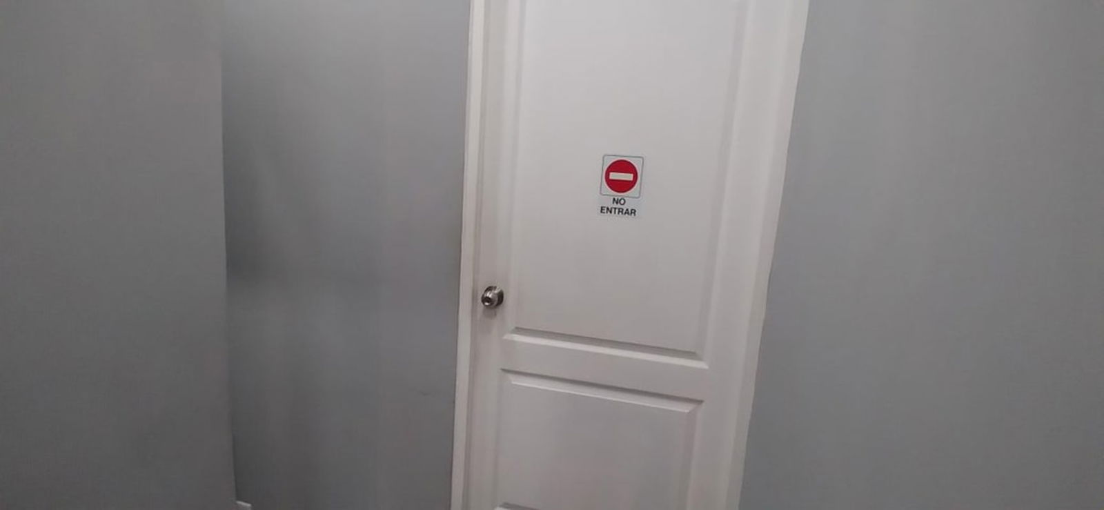 Minimalist office workspace in mezzanine of Mega Mall commercial property