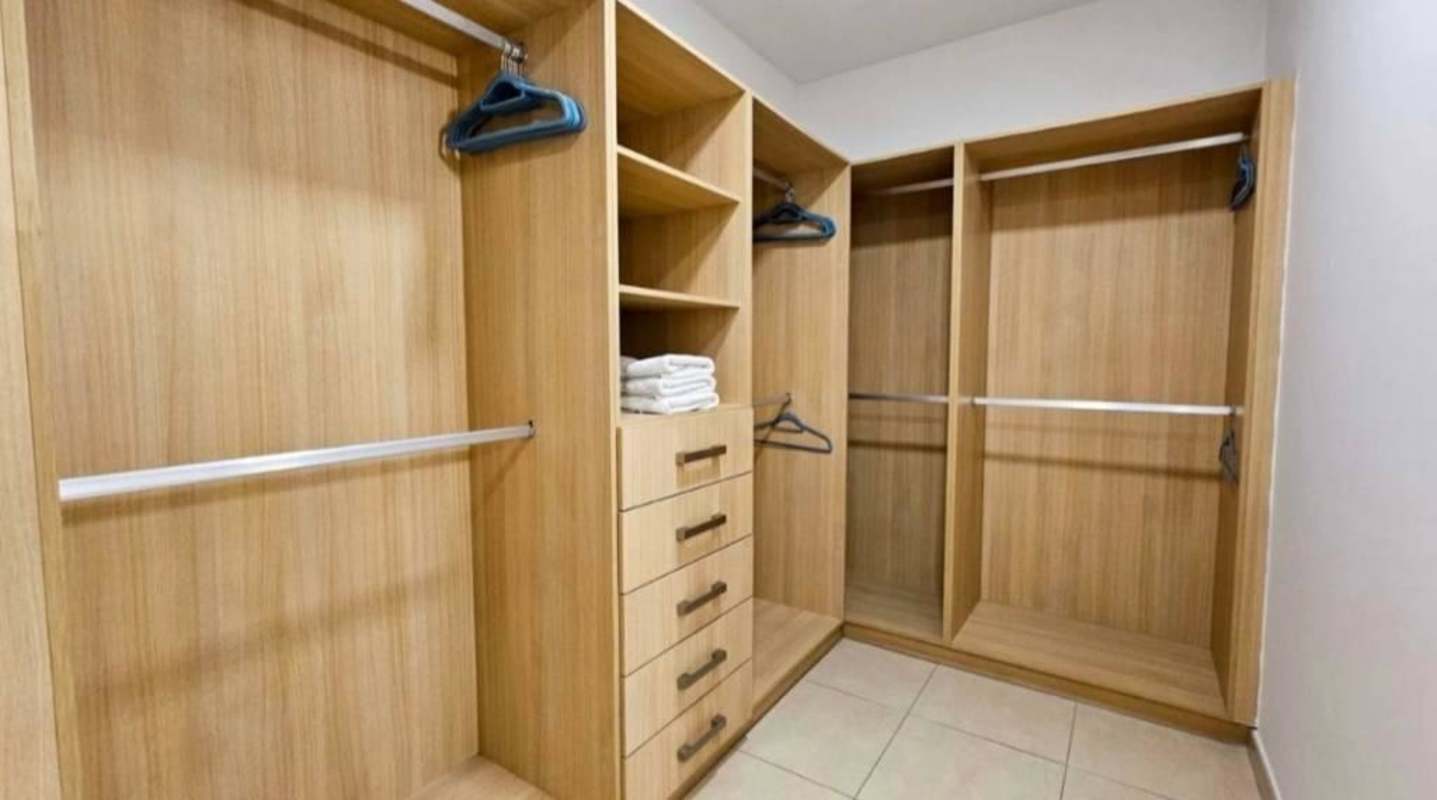 Bedroom with floor-to-ceiling window city and ocean view Waters on the Bay Panama
