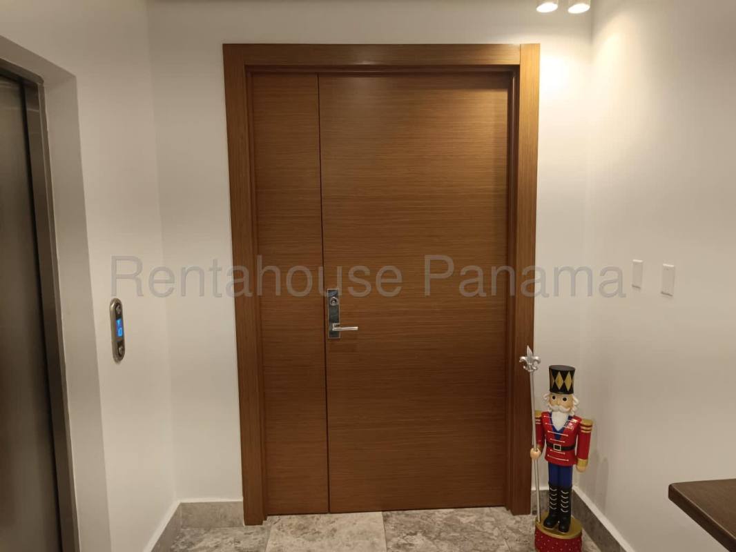 Living area with marble floors, balcony access, panoramic views in Empire Residences Panama