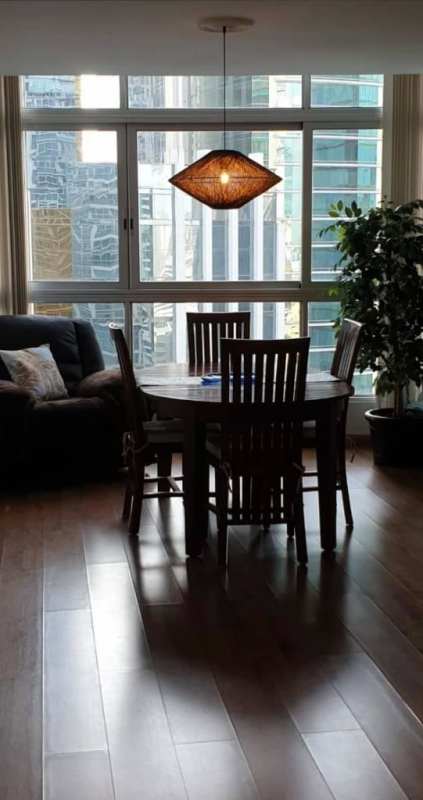 Spacious open plan furnished living dining room with ocean and skyline view PH Bay Front Tower Panama