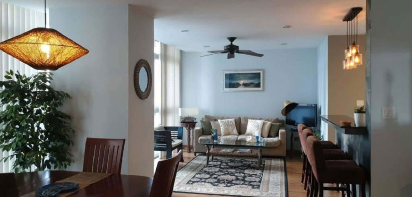 Spacious master bedroom with floor-to-ceiling sea view windows, walk-in closet, PH Bay Front Tower