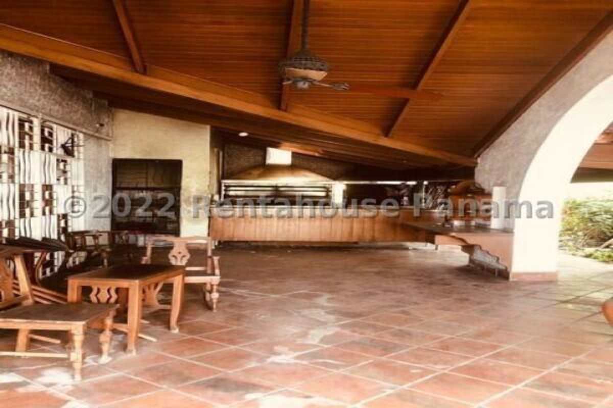 Open-air rustic patio terrace with clay tile floor and arches in San Francisco Panama City