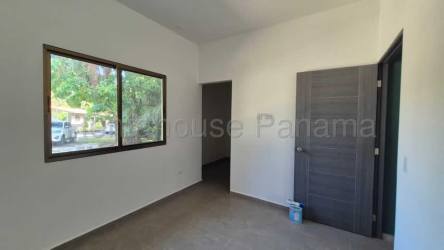 Bright bedroom with garden window view in modern house Villa Guadalupe David Panama