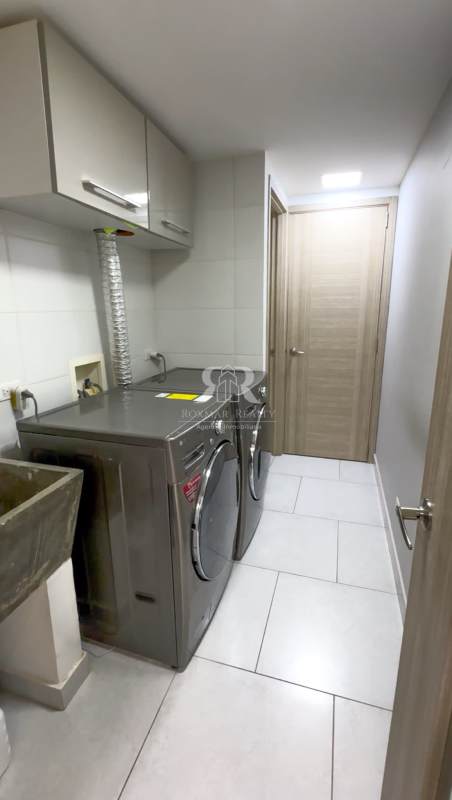 Rooftop soccer field with safety net and urban skyline view PH The Towers San Francisco Panama