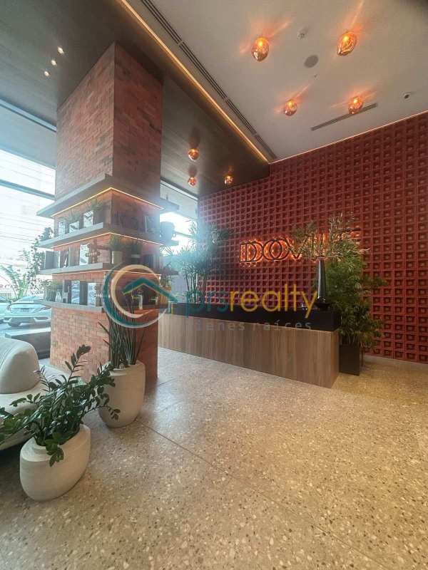 High-rise apartment interior with floor-to-ceiling windows and panoramic city views PH Dovle