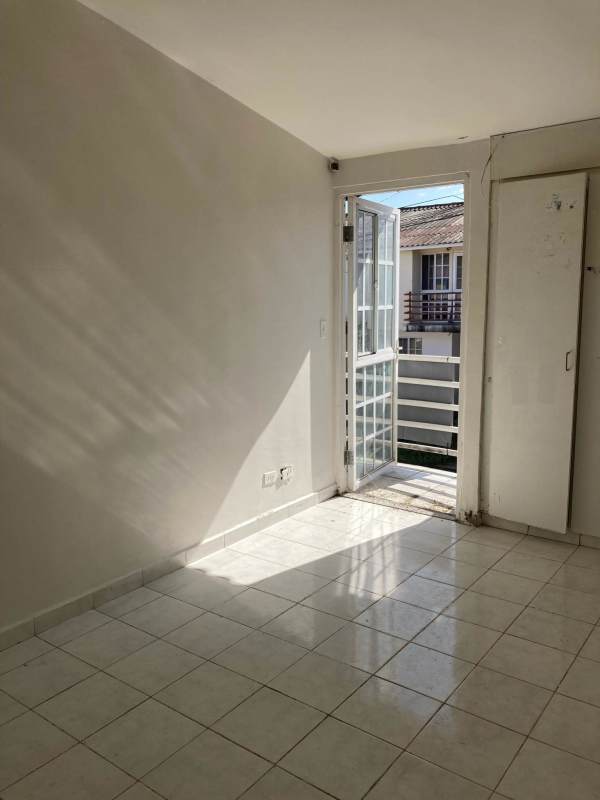 Compact rustic kitchen with brick design tiles in PH Mirador del Bosque Pacora Panama
