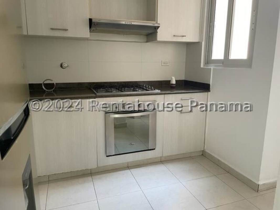 Compact kitchen with built-in appliances and light cabinetry Torres de Versalles Panama