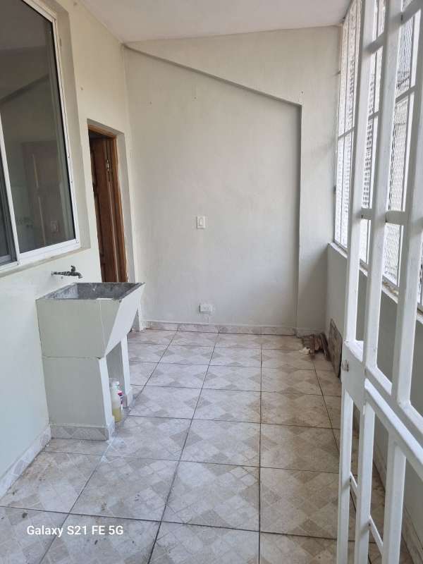 Kitchen with stone breakfast bar, ceramic tiles, and large window in PH Ines San Francisco Panama