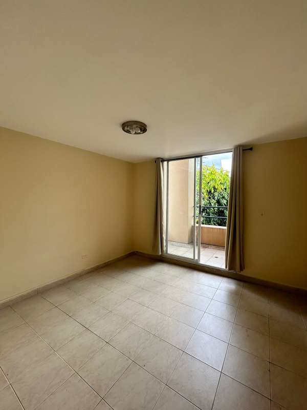 Bright bedroom with closet and window in PH San Francisco Bay apartment Panama City