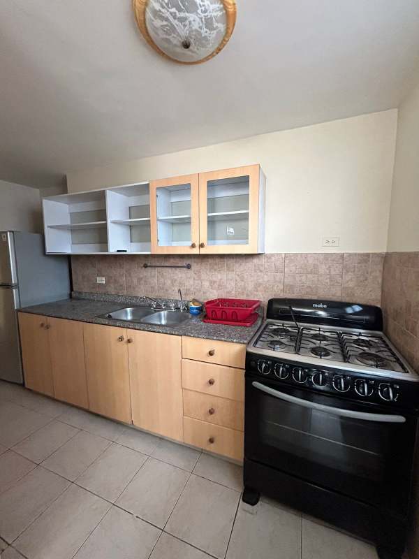 Contemporary kitchen with granite countertop, tile backsplash, refrigerator in PH San Francisco Bay Panama