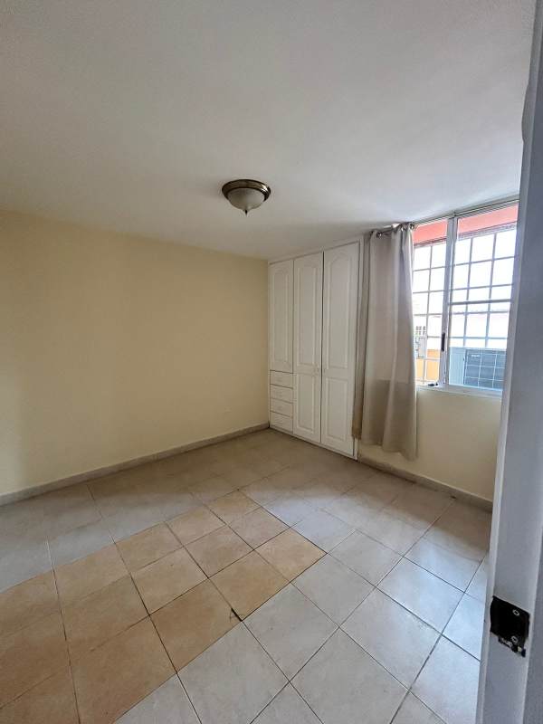 Bedroom includes built-in wardrobe, large window with curtains in PH San Francisco Bay Panama