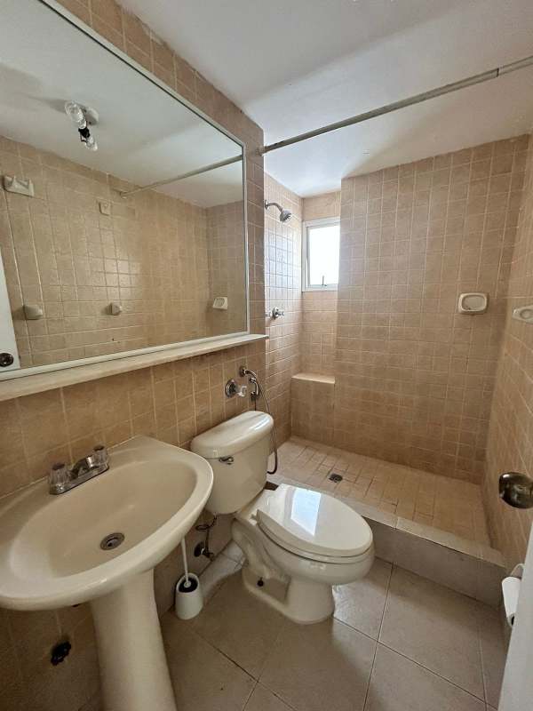 Bathroom featuring pedestal sink, walk-in shower and mirror PH San Francisco Bay Panama City