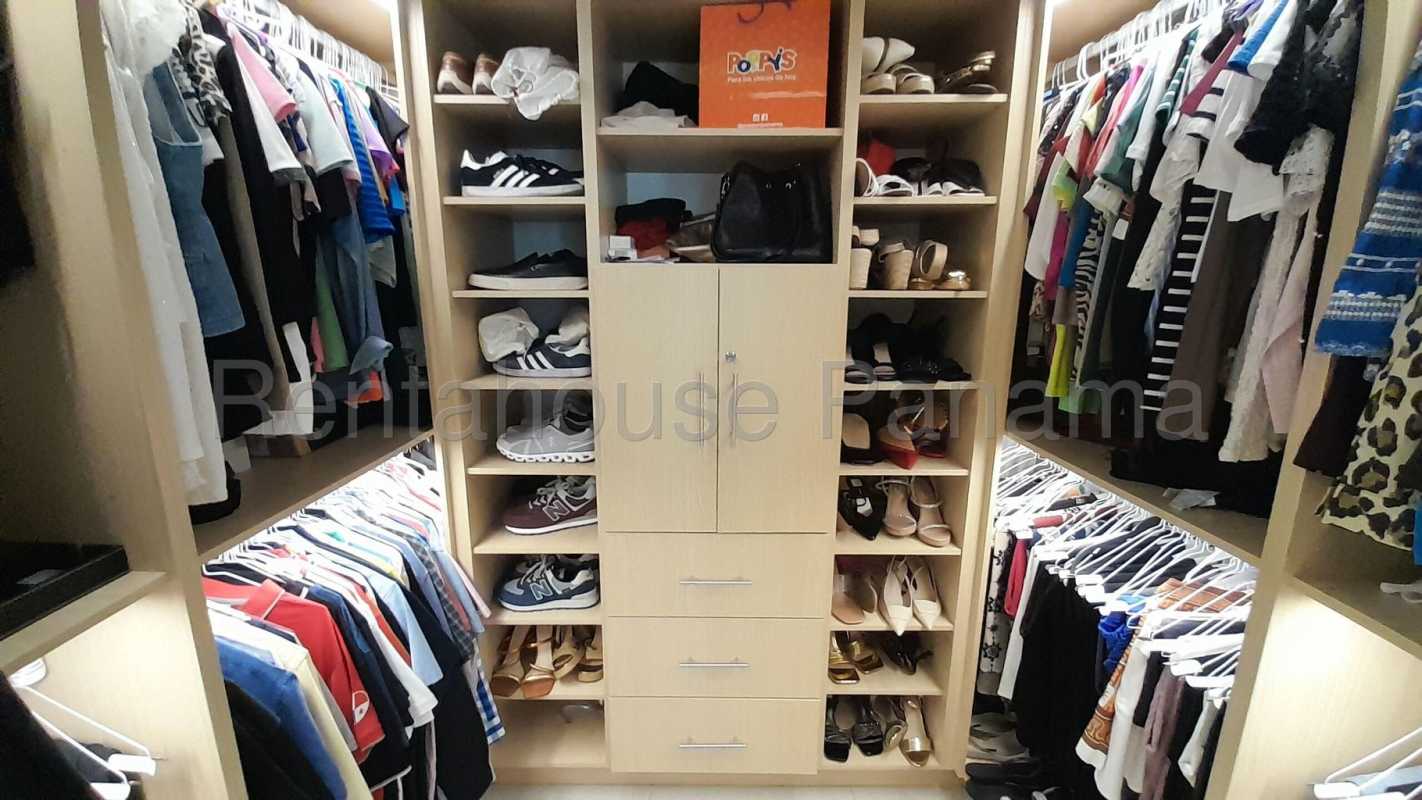 Sophisticated lobby with vertical garden, wood panel accent wall, modern decor PH South Coast Tower in Panama City