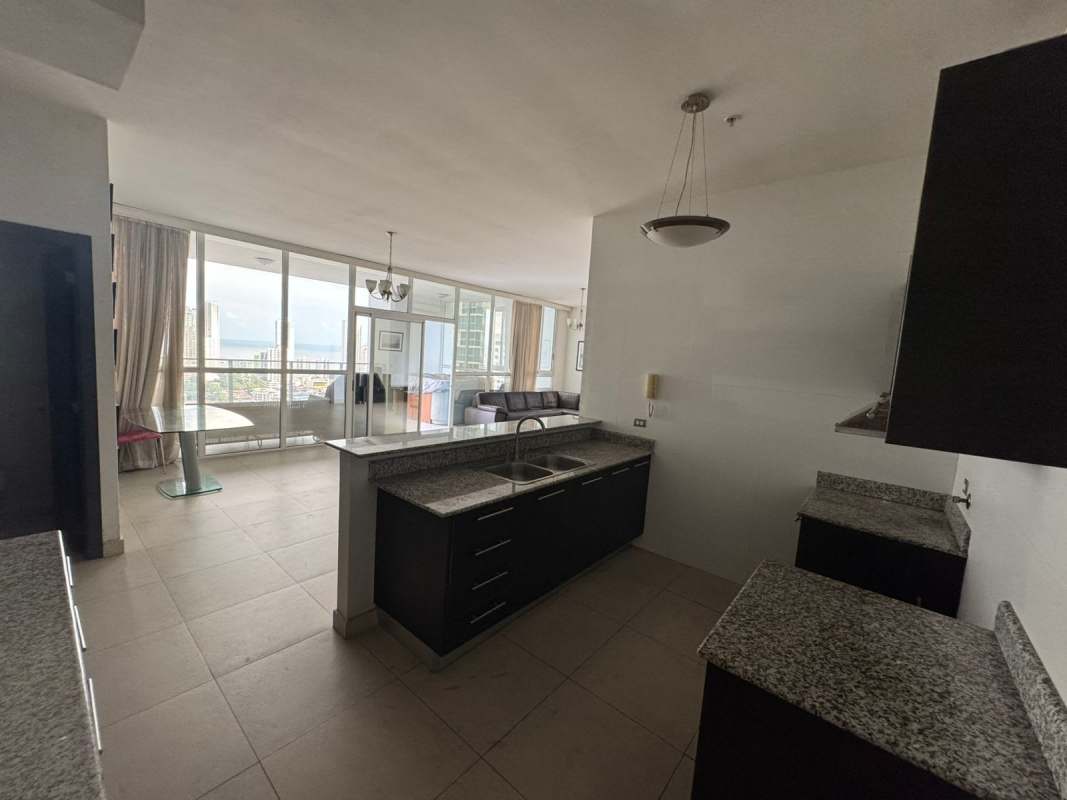 Bedroom with large window and city skyline view in PH San Francisco Bay Panama City