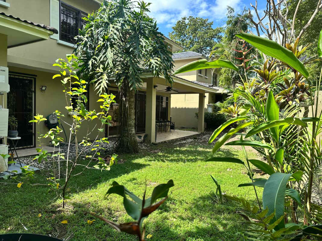 Kitchen in Embassy Gardens house with granite countertops and wood cabinets Clayton Panama