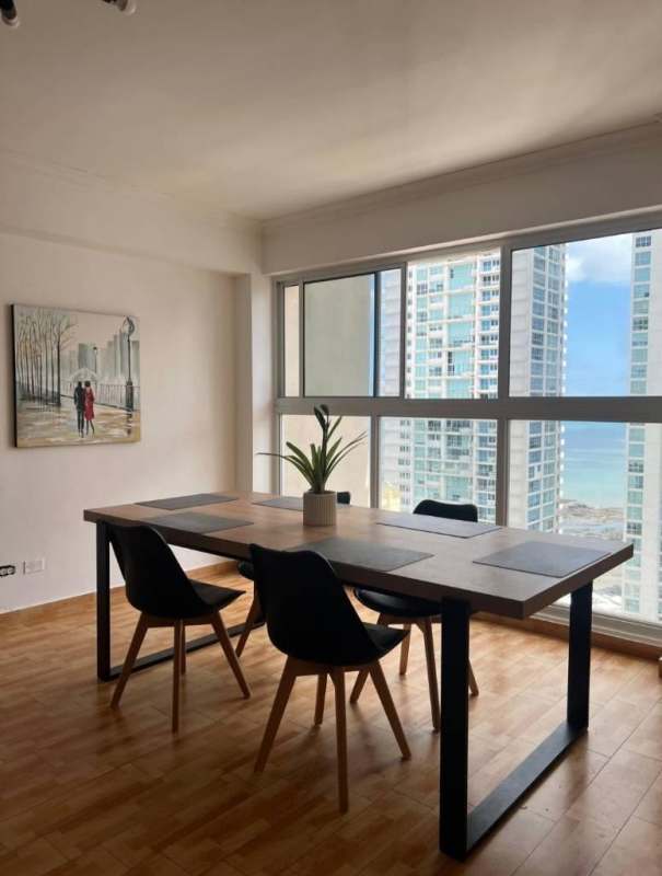 Dining area with full windows and ocean view penthouse Panama