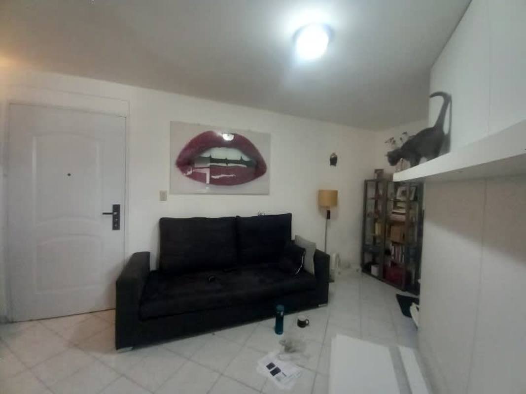 Kitchen with MDF cabinets, ceramic backsplash, stainless sink Carrasquilla Panama City apartment