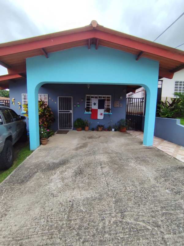 Front exterior view gated entrance carport Las Cumbres Panama house sale