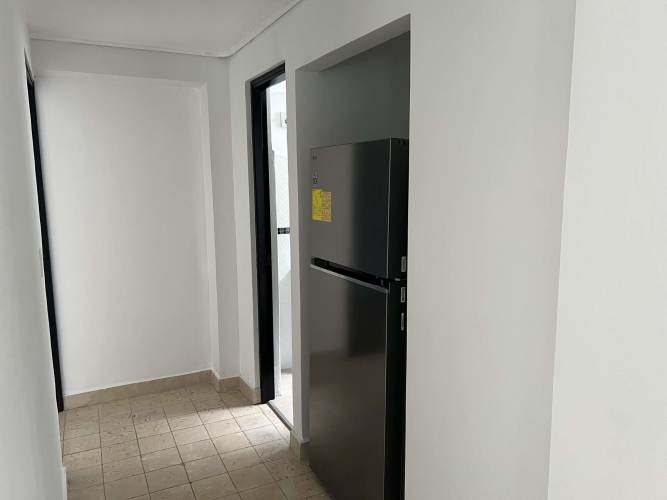 Hallway with refrigerator nook tiled floors modern design PH Vista Hermosa Panama