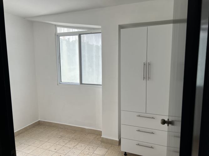 Second bedroom minimalist design tile floors in Panama City apartment rental