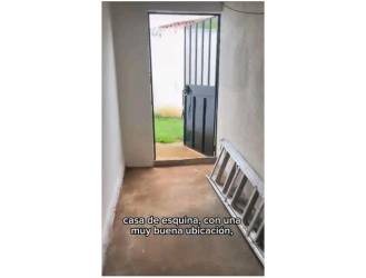 Living and dining area with large window in rental house Isla de Montelimar Costa Verde Panama